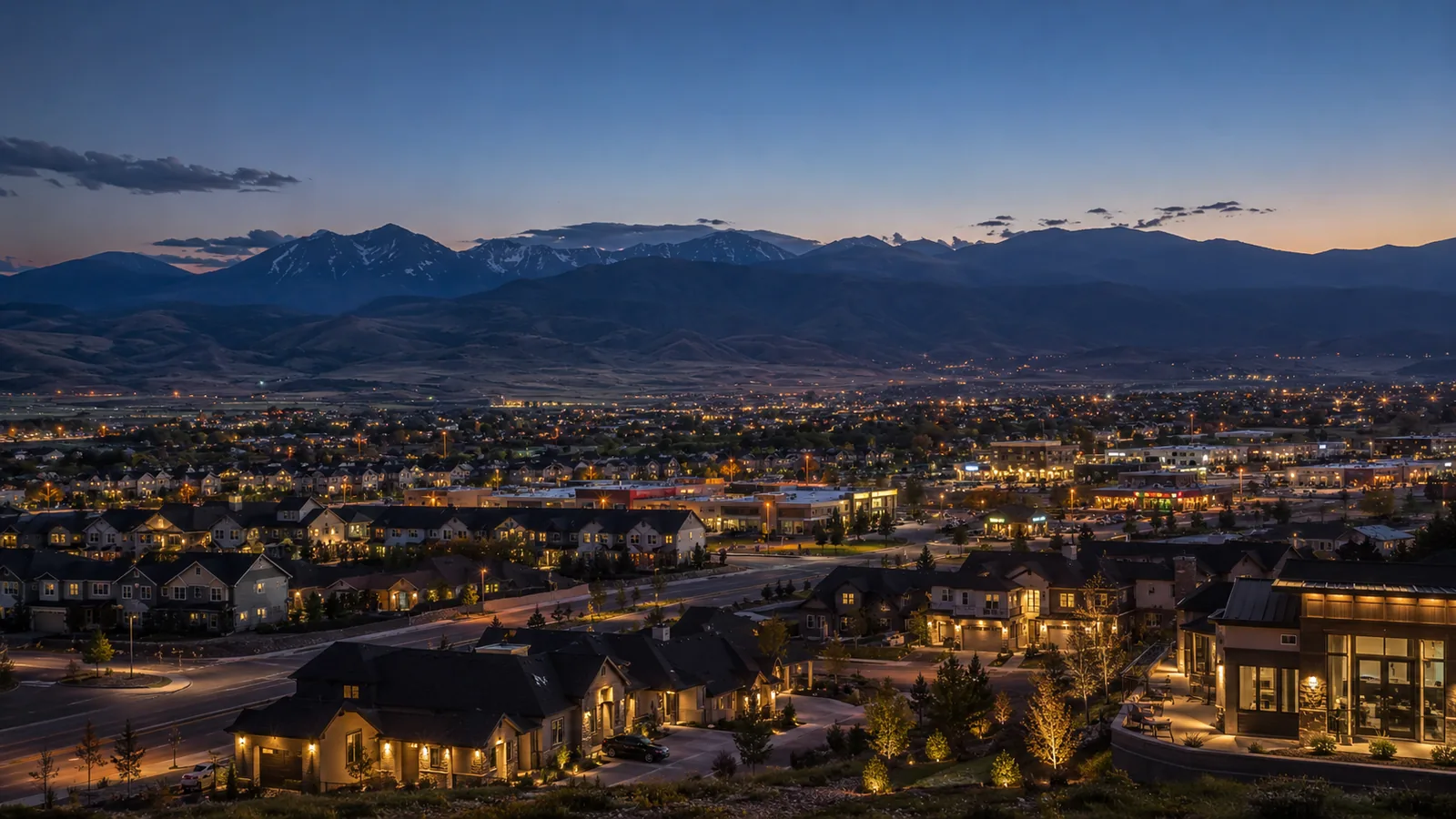 Evening view over Lehi, Utah neighborhoods and mountains representing Moonlight LED service-area coverage